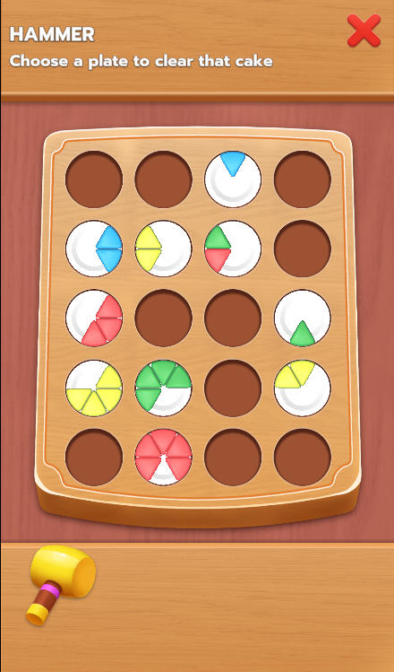 Using the Hammer power-up to smash a plate and clear space on the board