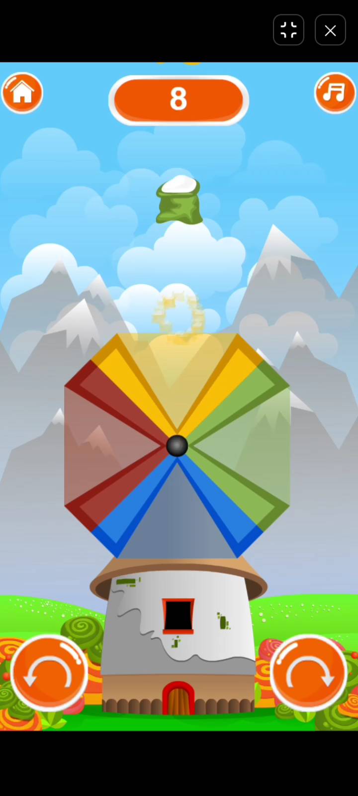 Whirly active gameplay showing color matching bags dropping onto the 4-color rotating fan blade